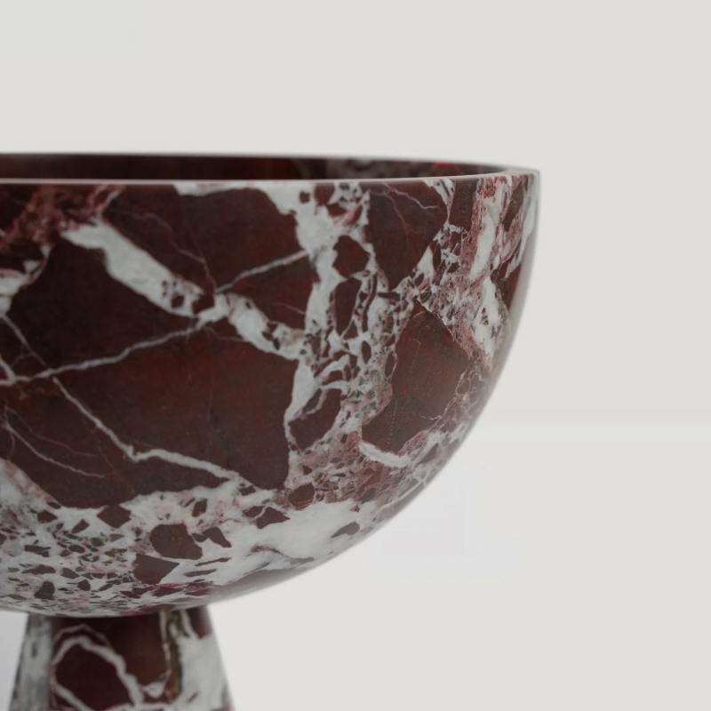 Close-up of burgundy veined marble pedestal bowl - unique texture decorative serving bowl