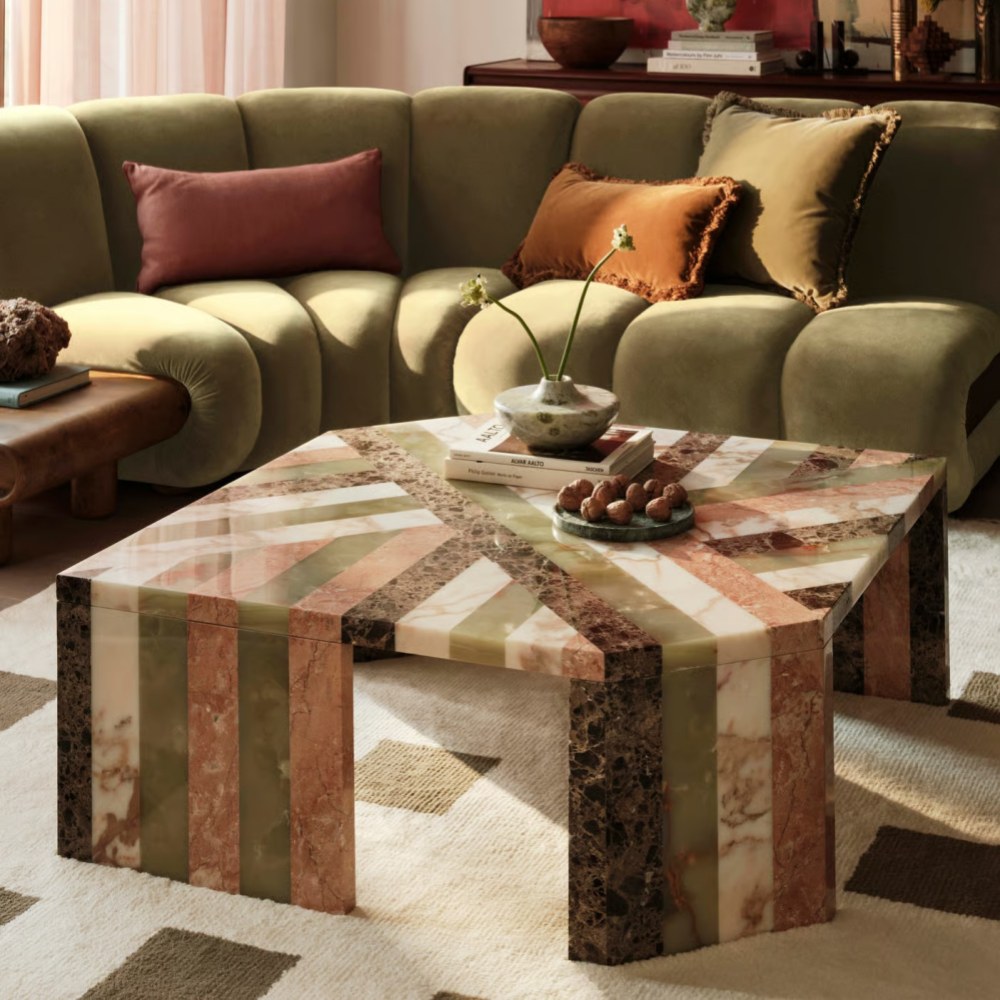 Modern Multi-Marble Composition Coffee Table next to green velvet sofa - styled modern home decor