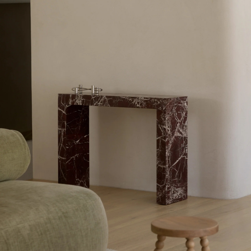 marble console table next to green sofa - styled living room wall furniture