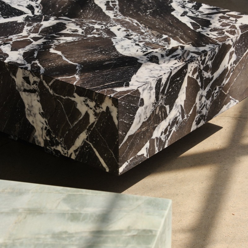 Breccia black marble coffee table styled in minimalist industrial space