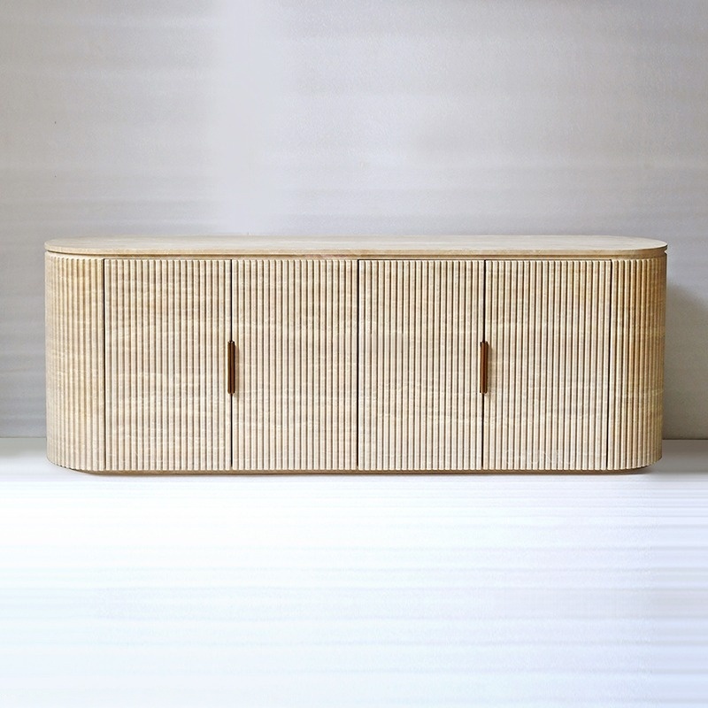 Close‑up of travertine sideboard – vertical fluted ribbed texture and natural stone veining